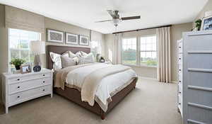 Bedroom with carpet flooring. Ceiling fan has not been selected for this home.Materials and colors may vary; this pictures is of a model home.