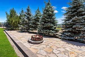 View of patio / terrace with a fire pit