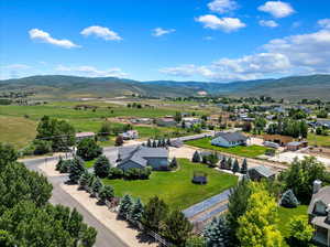 Birds eye view of property with a mountain view