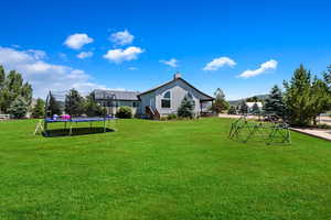 View of yard with a trampoline