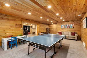 Playroom featuring wooden ceiling and light colored carpet