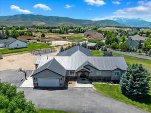 Birds eye view of property with a mountain view