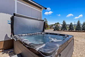 Exterior space featuring a hot tub