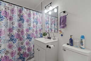 Bathroom with vanity and toilet