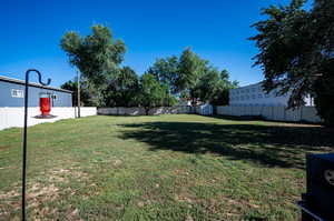 View of yard with a storage shed