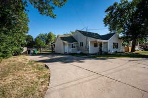 Bungalow-style home with a front lawn