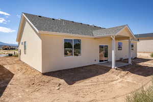 Rear view of property with a patio