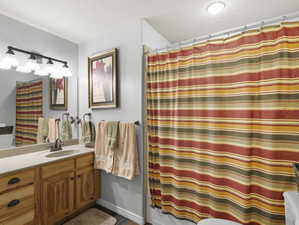 Bathroom featuring vanity and a textured ceiling