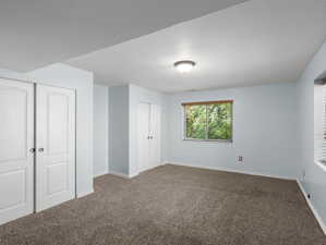 Unfurnished bedroom with carpet