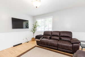 Living room featuring wood-type flooring