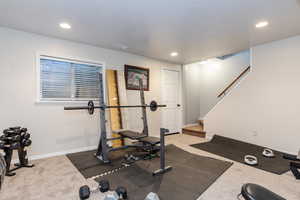 Exercise area featuring carpet floors