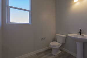 Main Level Powder Room *Photo of like floorplan with similar finishes, options may vary*