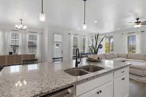 Kitchen with dark hardwood / wood-style floors, sink, and plenty of natural light