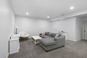 Living room featuring carpet floors