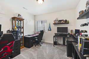 Office area featuring carpet flooring