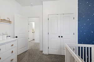 Hallway with carpet flooring