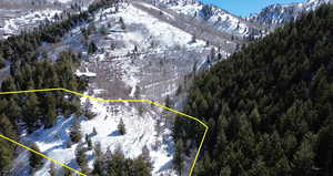 Snowy aerial view with a mountain view