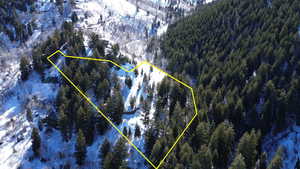 Snowy aerial view with a mountain view