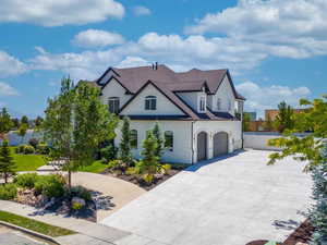 View of front of home and driveway with a huge RV parking area.