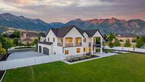 Gorgeous fully fenced yard with two decks, patio and a mountain view