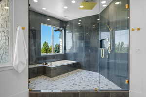 Bright spacious wet room with soaking tub.