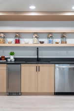 Second kitchen with sink, dishwasher, ice maker, beverage cooler and microwave.