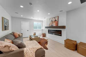 Large, bright downstairs family room with fireplace.