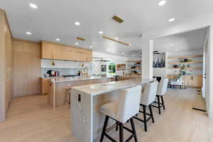 Open floor plan kitchen featuring double islands with extra seating.