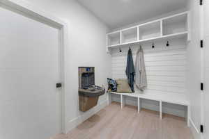 Mudroom with drinking fountain.