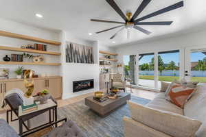 Family room featuring built in shelves/cabinets and a fireplace.