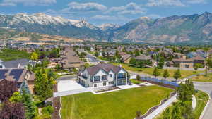 Birds eye view of property with a mountain view