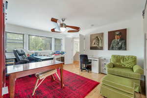 Office with plenty of natural light, ceiling fan, and light hardwood / wood-style floors