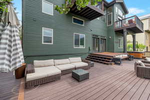 Wooden deck featuring a hot tub