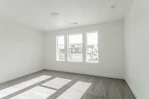 Empty room with carpet floors