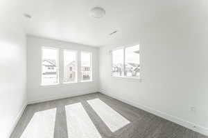 Unfurnished room featuring carpet flooring