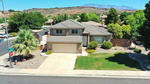 View of front facade featuring a mountain view and a garage