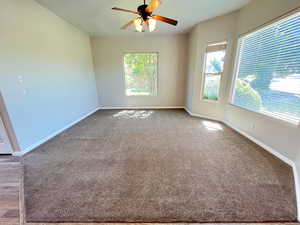 Unfurnished room with wood-type flooring and ceiling fan