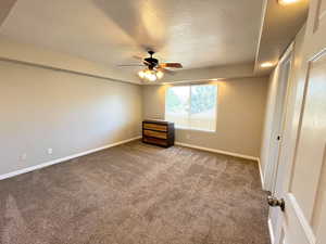 Spare room with carpet and ceiling fan