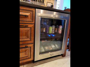 Beverage center refrigerator mounted under the countertop