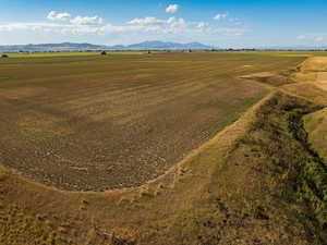 Birds eye view of property featuring a mountain view and a rural view