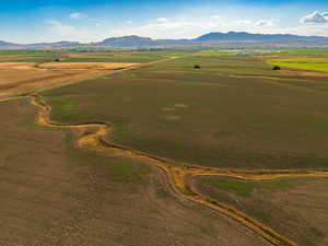 Aerial view featuring a rural view and a mountain view