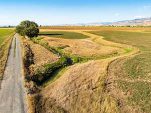 Aerial view featuring a rural view and a mountain view