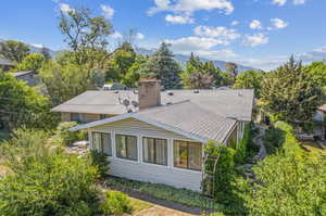 Back of house featuring a mountain view