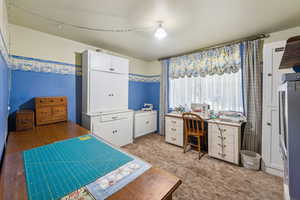 Bedroom with light hardwood / wood-style flooring