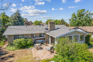 Rear view of property with a patio area