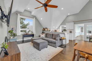 ADU Living room with lofted ceiling, ceiling fan, and wood-type flooring