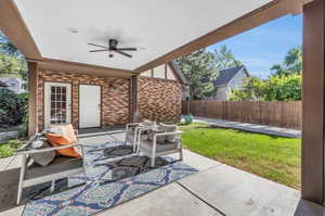 View of patio featuring ceiling fan