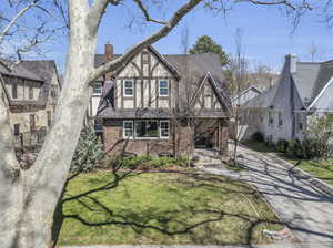 Tudor house featuring a front yard