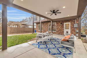 View of patio / terrace featuring a balcony and ceiling fan