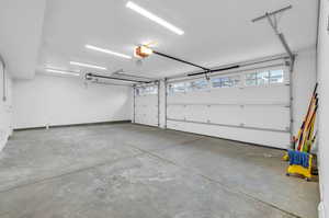 Garage featuring a garage door opener